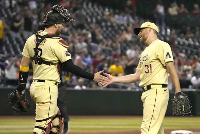 Ian Kennedy and Carson Kelly handshake after a win
